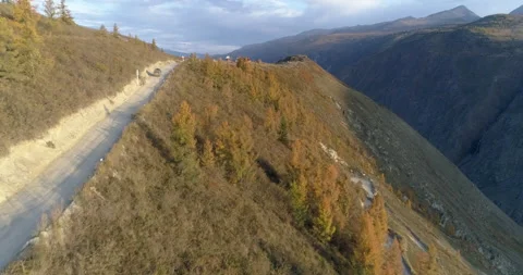 Drone flies above car going to observation deck of Katu Yaryk mountain pass Stock Footage 143963557