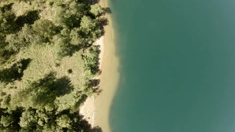 The drone flies above the coastline. Vertical, top-down Stock Footage 102713604
