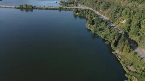 Drone flies above Danube river towards camp site with fishermen on a shore Stock Footage 263133470