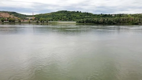 Drone flies above river Danube towards town Kovilj on hills in Serbia Stock Footage 269540344