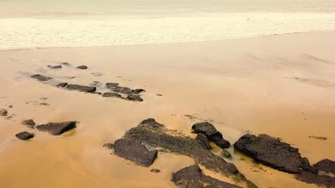 The drone flies above the sandy beach. Stock Footage 114451558