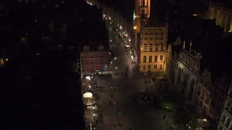 The drone flies above the sidewalk in Gda?sk at night. Stock Footage 106946811