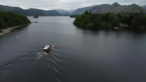 Drone flies above tourist launch on Derwentwater, Lake District, UK Stock Footage 241925803