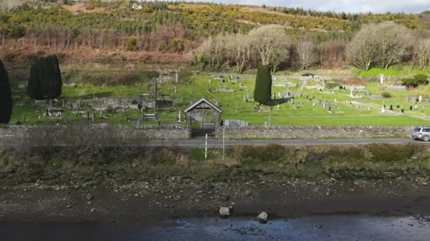 The drone flies across the river to the old catalic cemetery Stock Footage 234111497