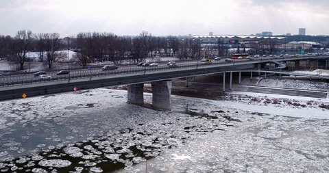 The drone flies along the bridge over the frozen Vistula river. Stock-Footage 107692927