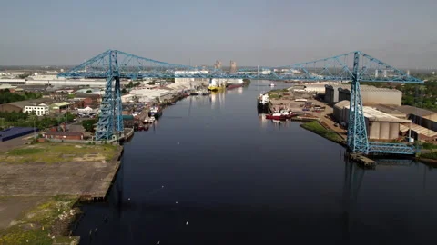 Drone flies along River Tees towards Transporter Bridge Stock Footage 244404794