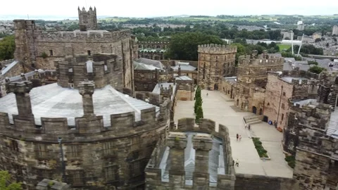 Drone flies alongside medieval castle in English town Stock-Footage 159706632