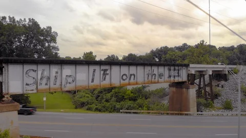 Drone Flies Up and Over an Empty Train Track With Power Lines in the Foreground Stock-Footage 128823398