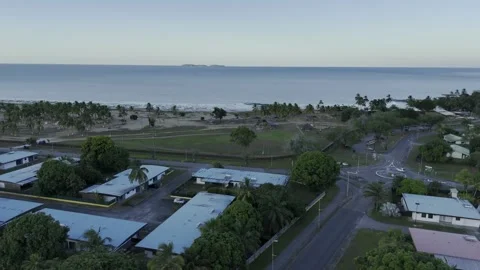 Drone flies up and over Grand Parc de la Cocoteraie toward the Salvation Islands Stockbeeldmateriaal 289039655