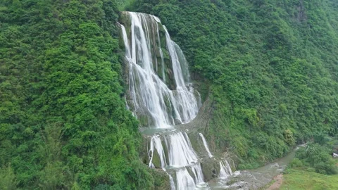 The drone flies around the 400-meter three-stage waterfall. Stock Footage 311749505