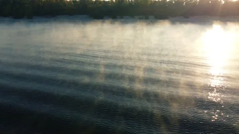 Drone flies around a buoy on the river, morning mist over the water, fog Stock Footage 186074307