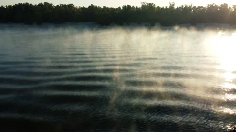 Drone flies around a buoy on the river, morning mist over the water, fog Stock Footage 186081922