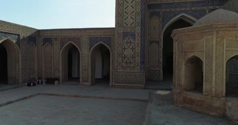 The drone flies around the courtyard of the ancient complex Lyab-i Hauz with Stock Footage 277872393
