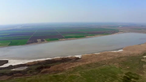 Drone flies around large dry lake in summer in nature reserve Slano Kopovo Stock Footage 270501891