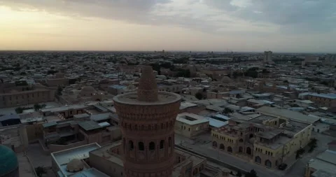 The drone flies around the minaret of the architectural complex Poi-Kalon. In Stock Footage 256291362
