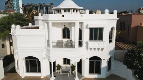 Drone flies around a private Arab villa with a swimming pool against the Stock Footage 308279922