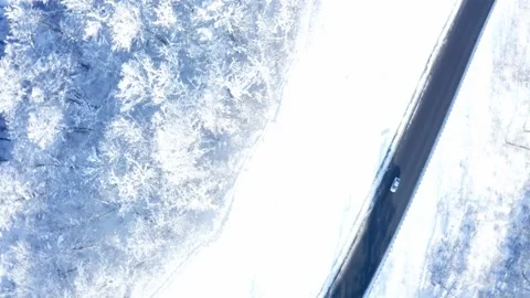 Drone flies around the road in winter in the mountains Stock Footage 147552244