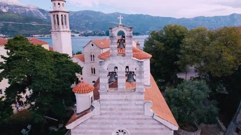 Drone flies back and down from church bells Stock Footage 223878943