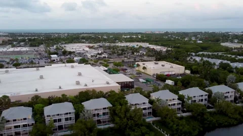Drone flies back over Parrot Key Hotel Villas toward Garrison Bight in Key Stock-Footage 321519300