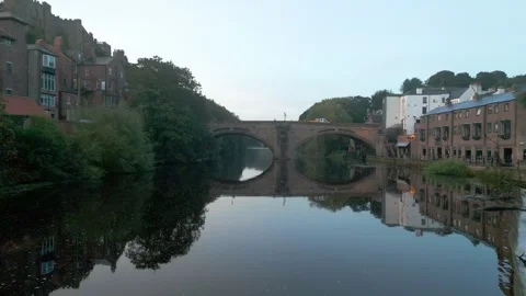 Drone flies back over weir on the River Wear in Durham. Stock Footage 278028453