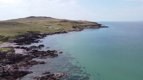 Drone flies backwards from headland, rocky shore, Scotland Stock Footage 159706571