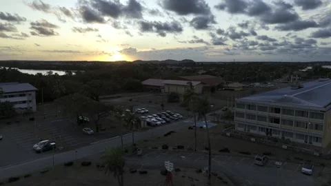 Drone flies backwards over Dreyfus Tower facing sunset in Kourou Stock Footage 289131188