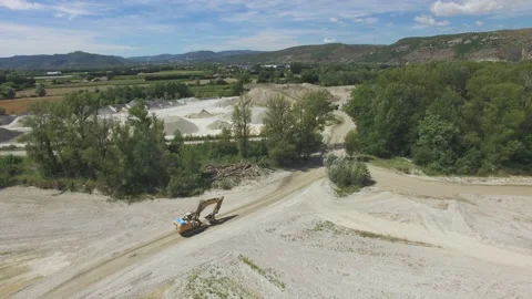 Drone flies backwards over a dry river in France Stock Footage 145990320