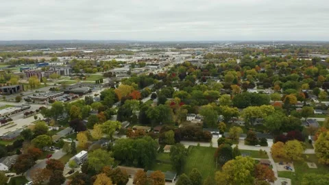 Drone Flies Backwards Over Suburban Homes with Fall Colors. Green Bay, Stock Footage 143303708