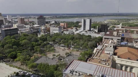 Drone flies backwards from Plaza de la Democracia Paraguay facing the Costanera Stock-Footage 293990441