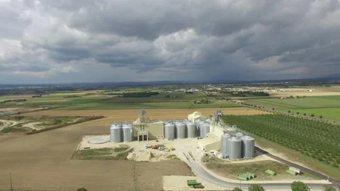 Drone flies backwards a wheat silo in France Stock Footage 145991187