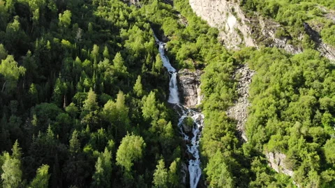 The drone flies to a beautiful waterfall through the air Stock Footage 158804550