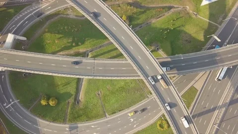 The drone flies beautifully over a multi-level intersection Stock Footage 164553807