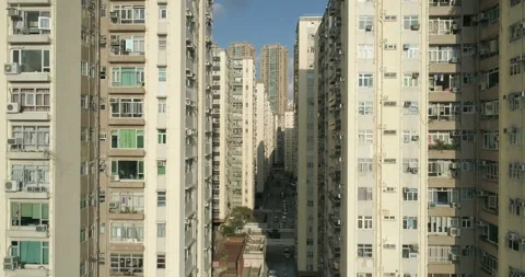 The drone flies between and above tall apartment blocks Stock Footage 98028661