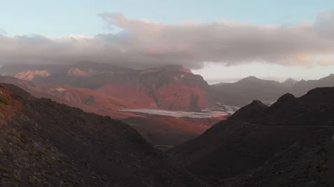 The drone flies between the mountains - sunset in a desert valley, serpentine Stock Footage 112355243