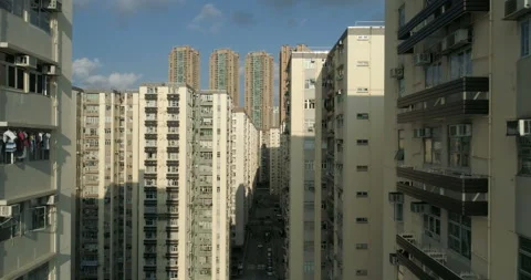 The drone flies between tall apartment blocks. Scenery of overcrowded apartm Stock Footage 94648982