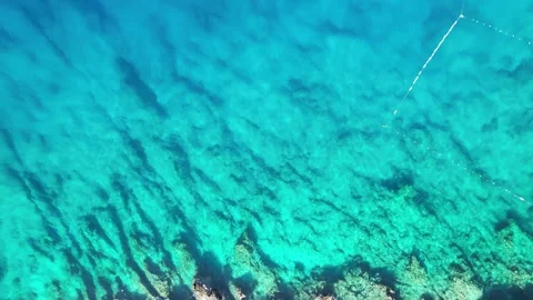 The drone flies into the blue sea Stock Footage 300003900