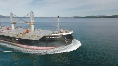 Drone flies close around bow of cargo ship United Harmony in Salish Sea Stock Footage 172460802