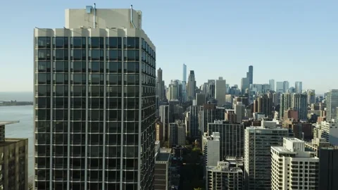Drone Flies Close to High Rise Apartment Building Chicago Skyline in Background 스톡 동영상 130403211