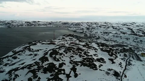 The drone flies up to the communication towers in a small northern town on the Stock Footage 169464056