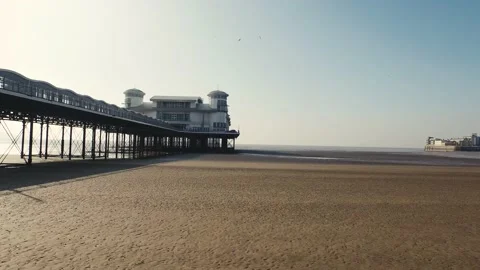 Drone flies down lenght of Weston-super-Mare Pier Stock Footage 135810045