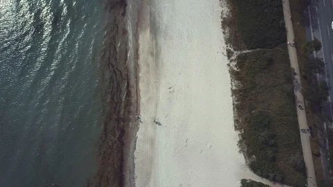 DRONE FLIES DOWN SLOWLY AT BEACH Video stock 112228793
