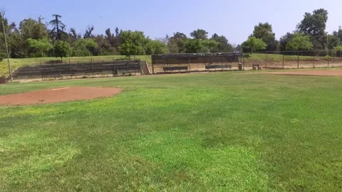 Drone flies to dugout, empty baseball field Video stock 136561442
