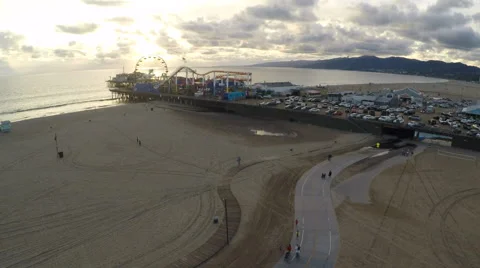 Drone flies at dusk over beach to Santa Monica Pier 04 Stock Footage 58656789