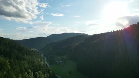 Drone flies in the evening to windmills under beautiful clouds Stock Footage 176649969