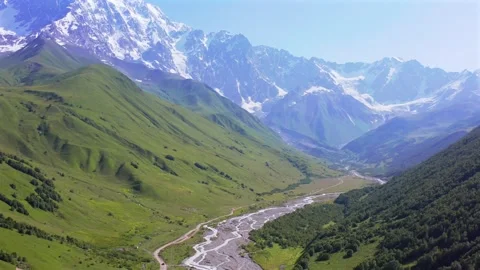 Drone flies forward above Enguri valley toward Shkhara massif near Ushguli Vídeo Stock 343542803
