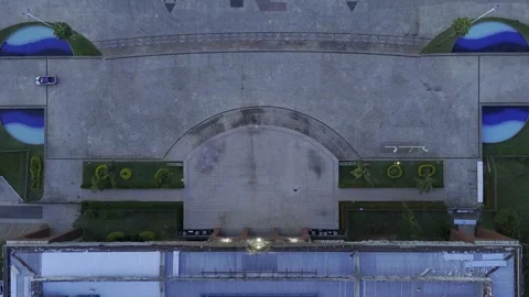 Drone flies forward with camera down over Palacio and compass painted on ground Stock Footage 274885211