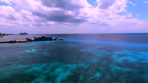 Drone Flies Forward over Blue Pacific Water and Ship at Pier Video stock 347152792