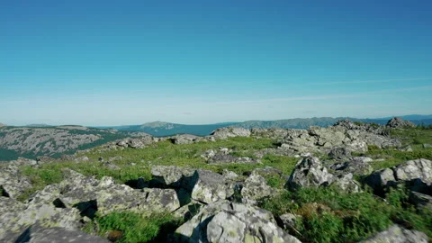 Drone flies forward over mountain range on sunset. Silhouette of peaks of mount Stock Footage 138003472