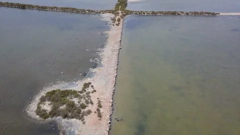 A drone flies forward a salt mine route from above in a sunny day. Stock Footage 221738013