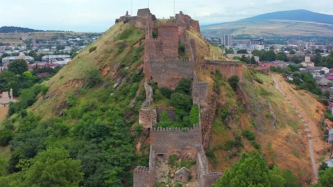 Drone flies forward toward Gori Fortress in Georgia, approaching defensive walls Stock Footage 340767775
